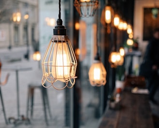 shallow focus photography of store pendant lamps