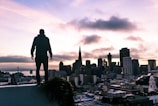 A beautiful San Francisco skyline with rooftops in the foreground.