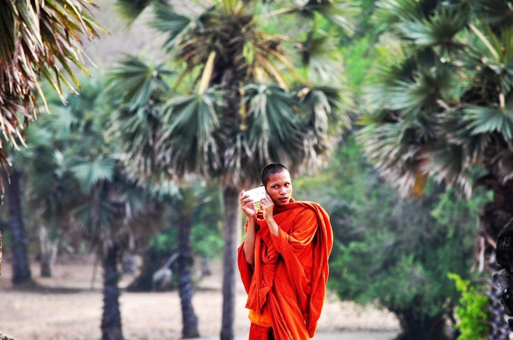 shallow focus photography of man walking