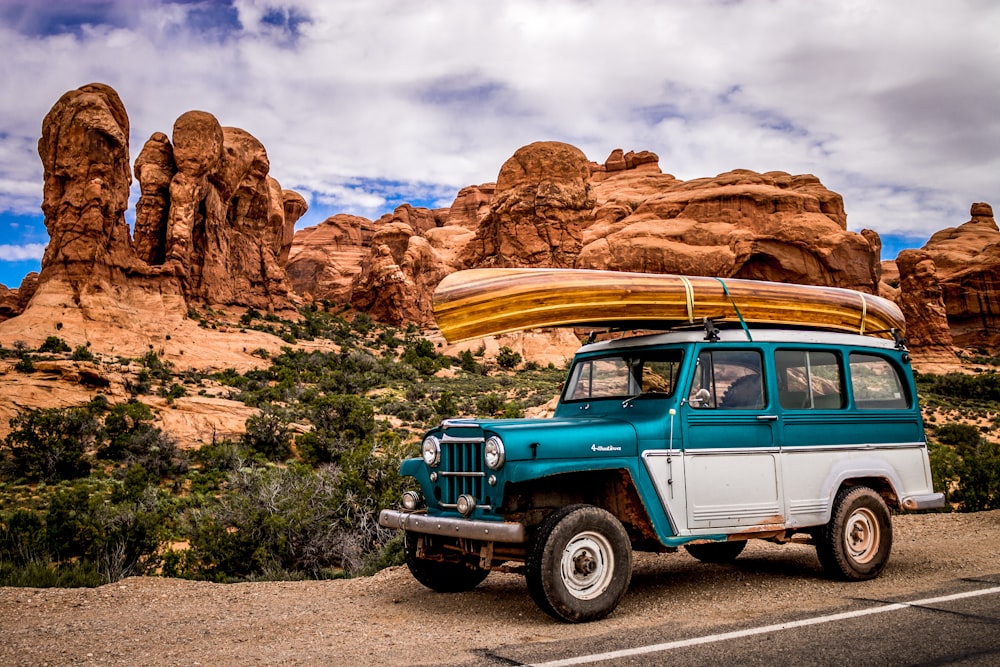 teal and white SUV