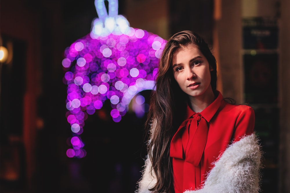 selective focus photo of woman wearing red collared top