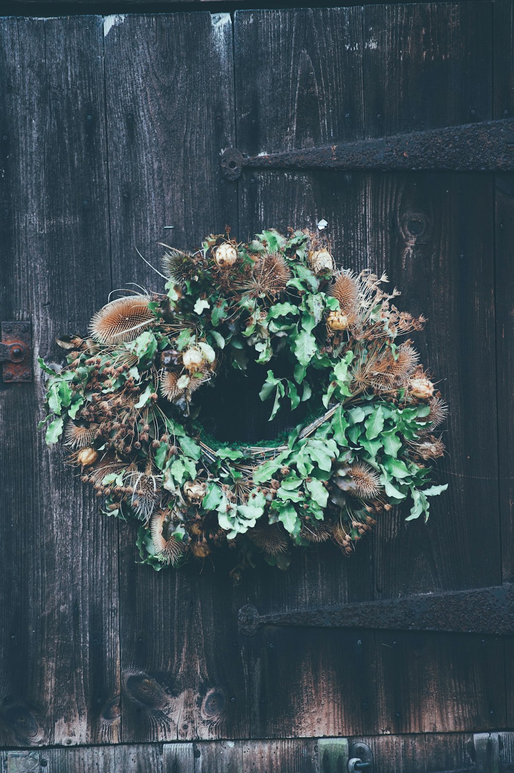 hanging green and brown floral wreath