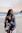 woman wearing monokini and standing on seashore