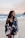 woman wearing monokini and standing on seashore