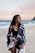 woman wearing monokini and standing on seashore