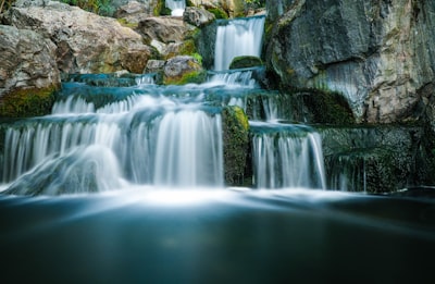 waterfall at daytime waterfall teams background