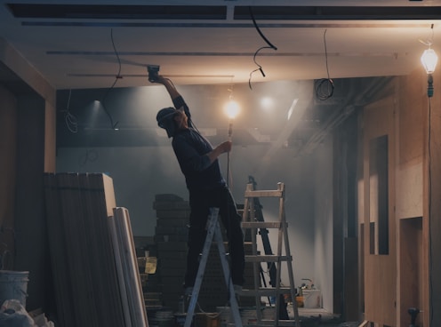 man on white ladder