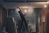Worker repairing a damaged ceiling after removing a wasp nest, showing clean and professional finish.