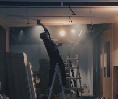 man on white ladder