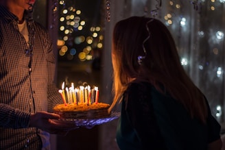 photo of birthday birth about to blow birthday candles