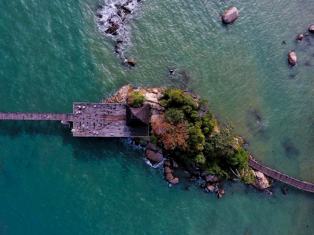 high angle photography of island with sea