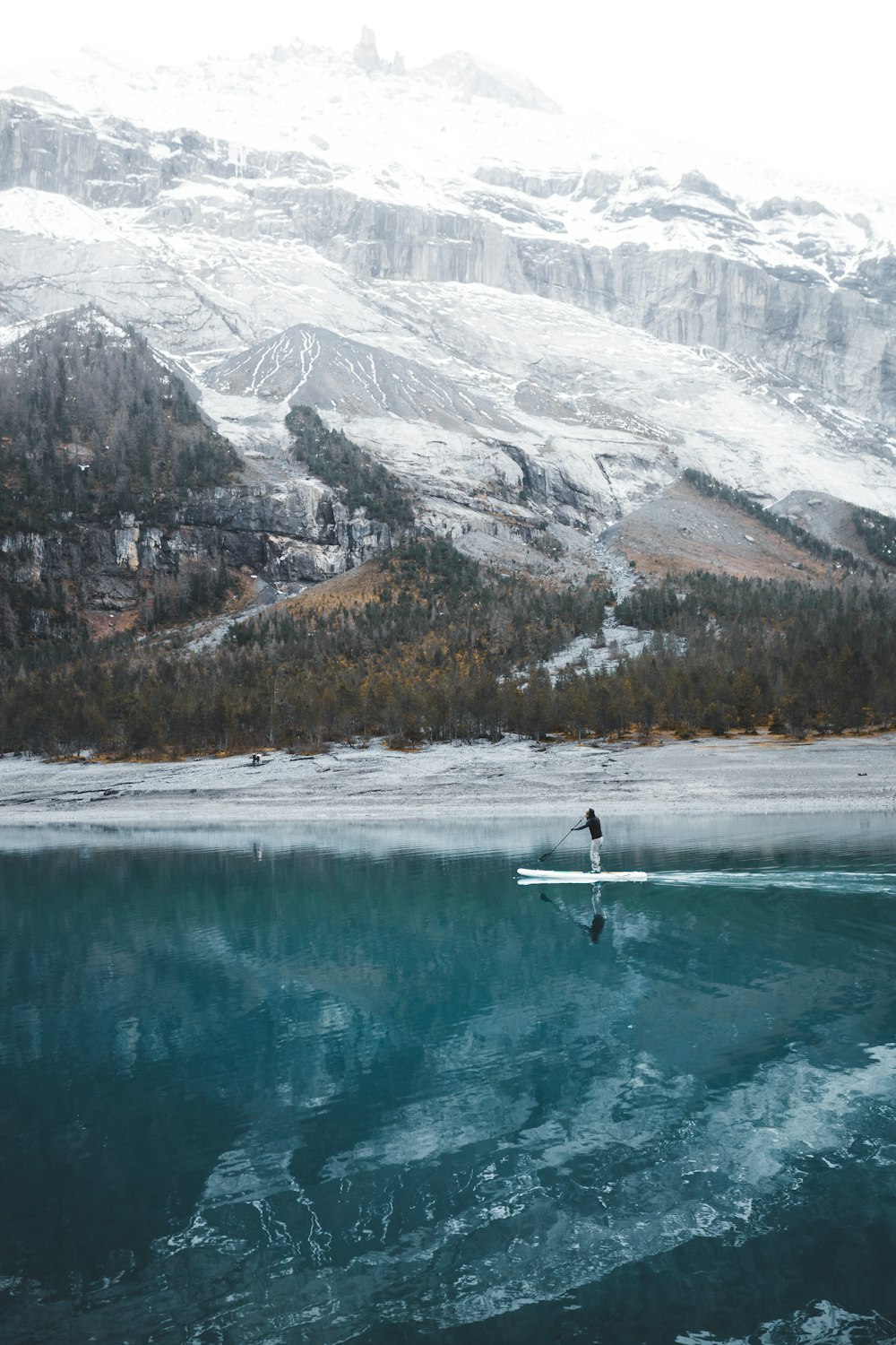 person doing paddle board