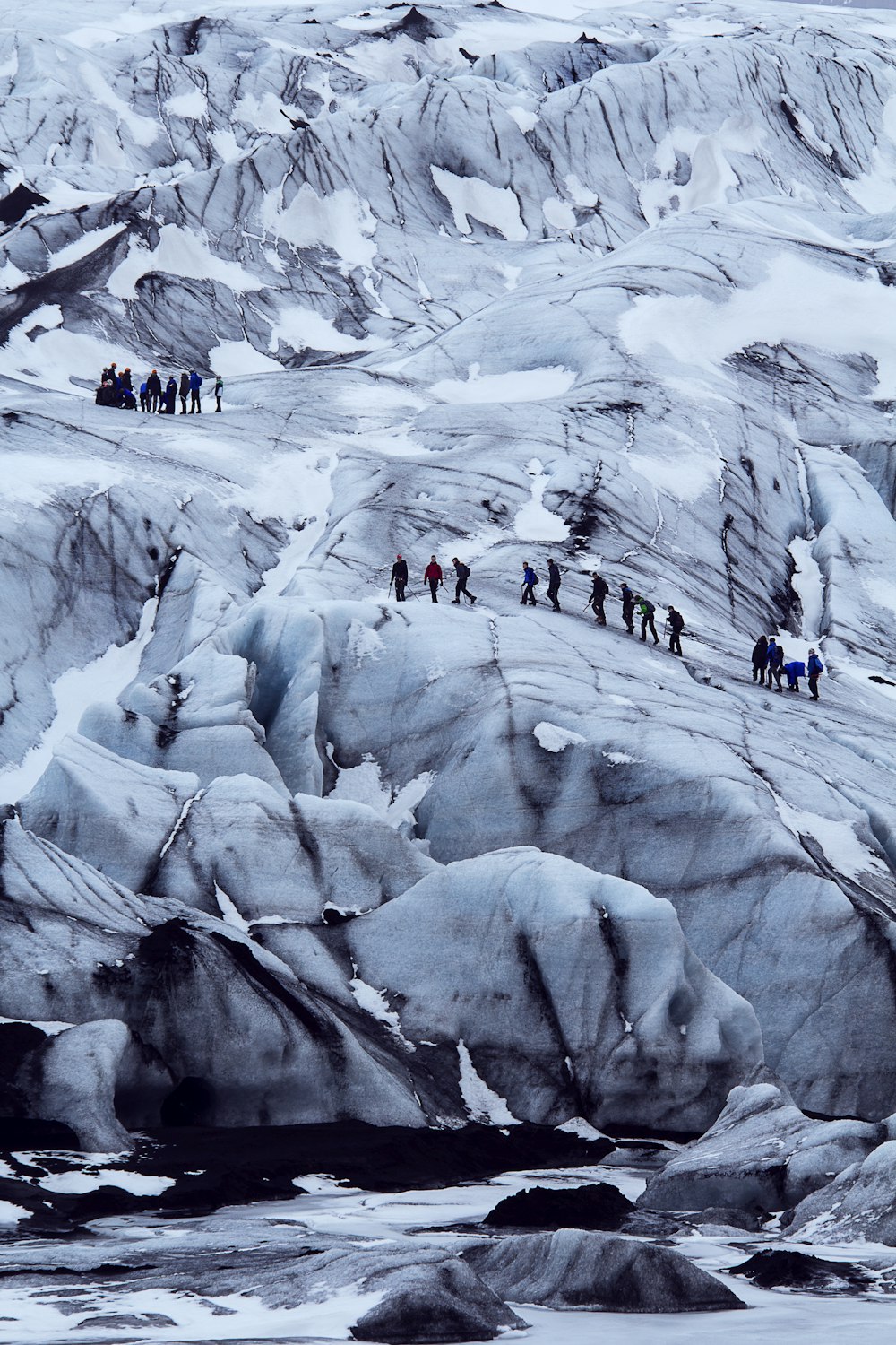 people on snow covered mountain