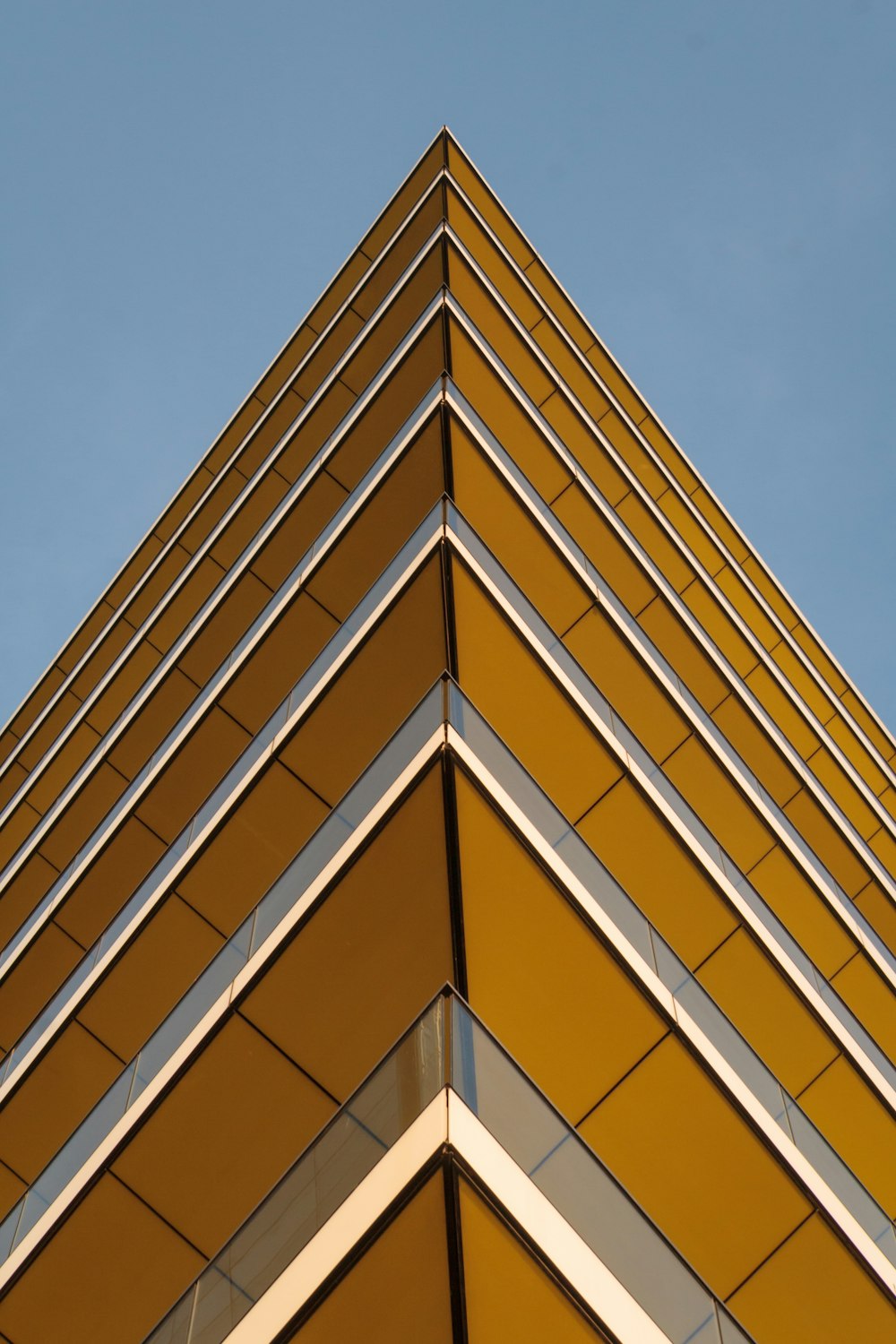 worm's-eye view photography of yellow building