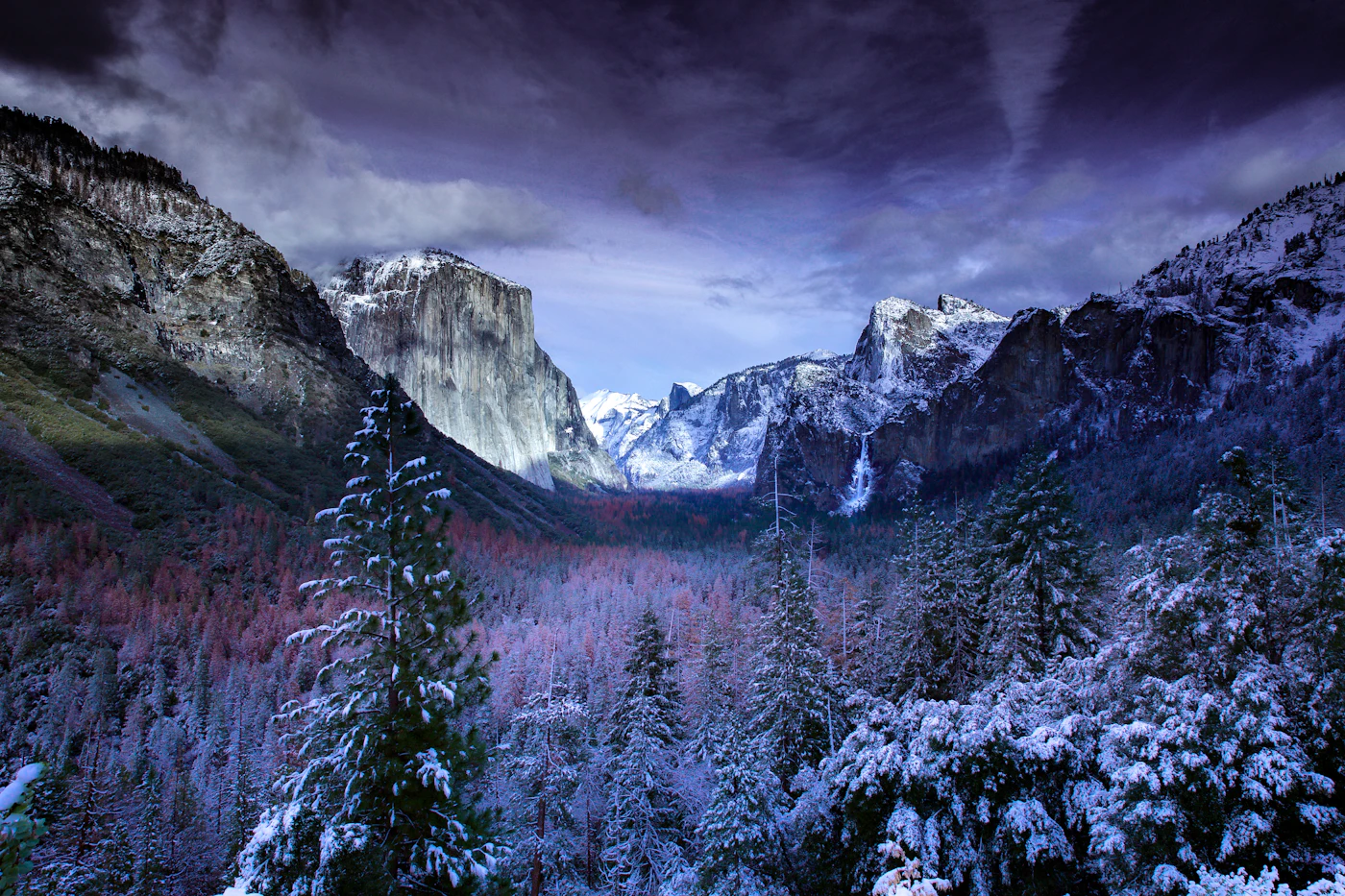 Snow covered Alpine village in winter with mountains
