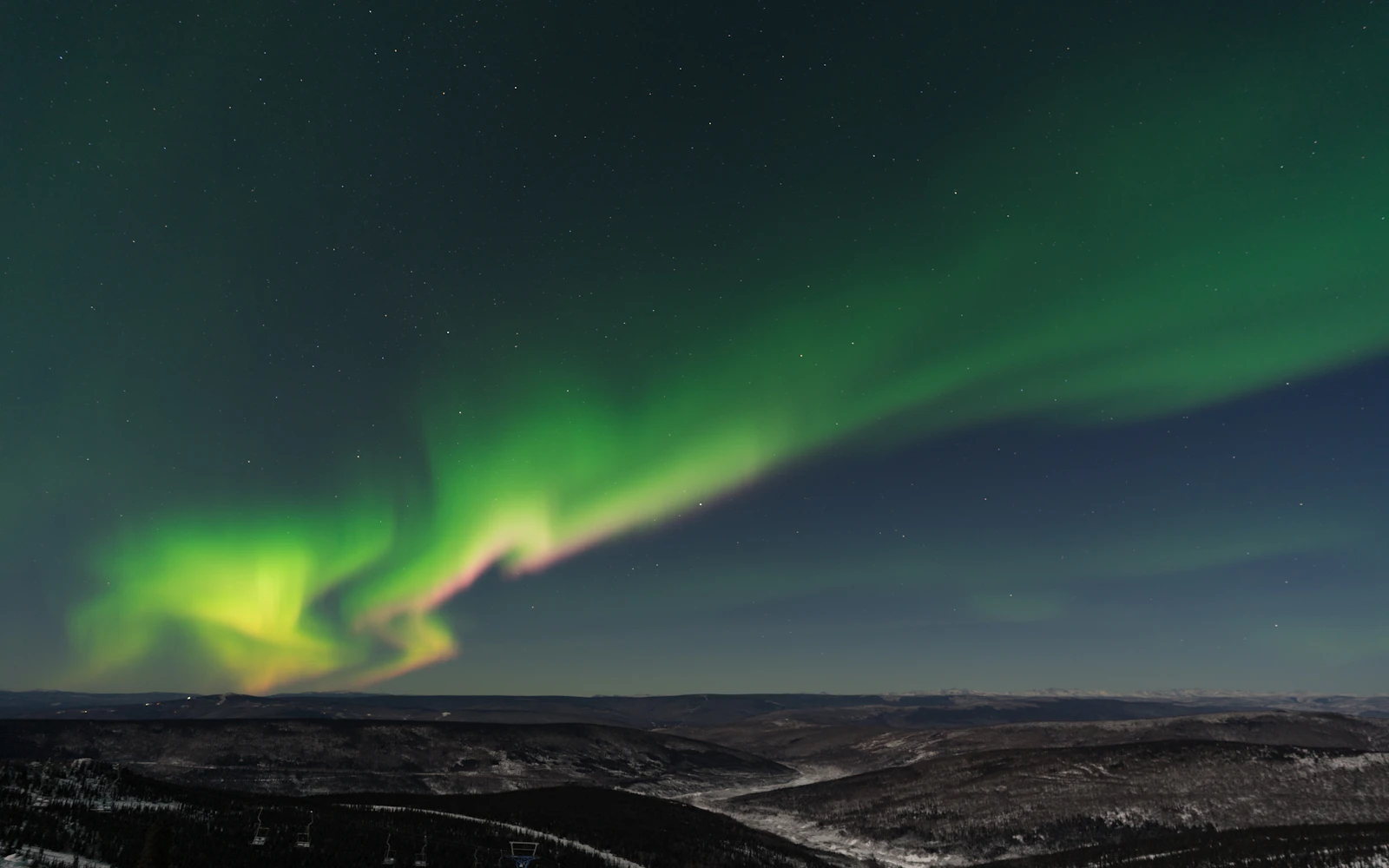 The aurora from the Cleary Summit viewing area outside Fairbanks — Alaska, United States
