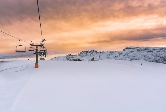 cable train over snowy field in Seiser Alm Italy