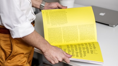 person holding book