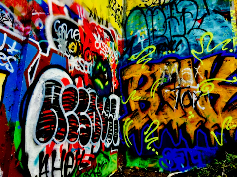 Urban graffiti wall with music notes and vibrant colors.