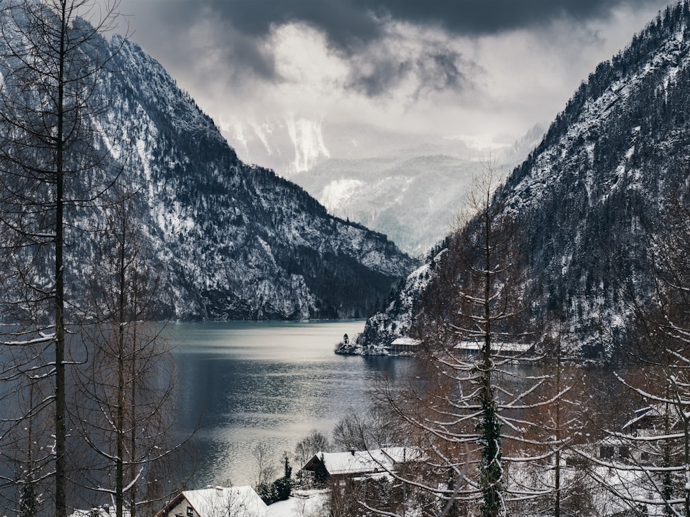 body of water surrounded with mountains