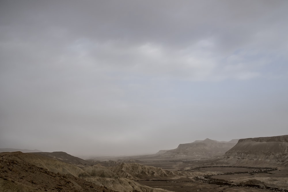 photo of valley under blue sky