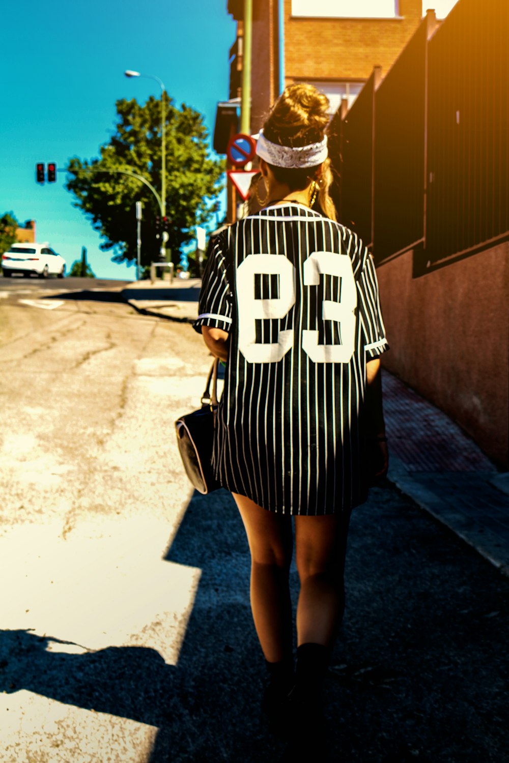 woman walking on the street during day time