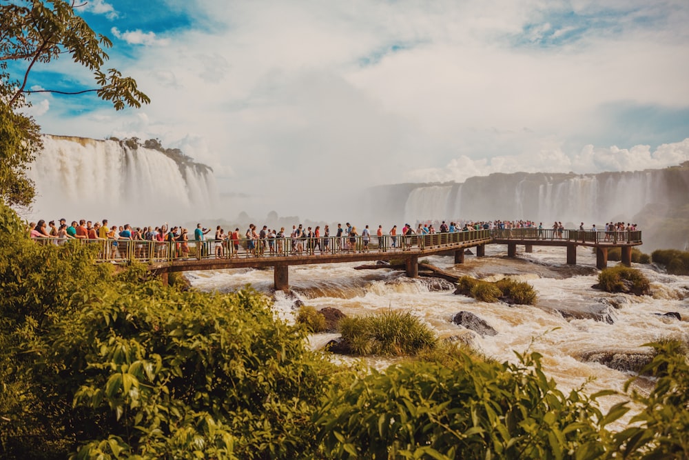 landscape photo of people on bridge