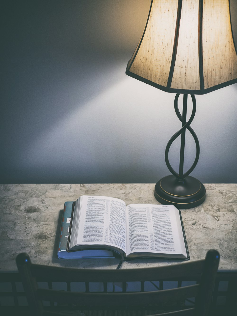 book beside the table lamp