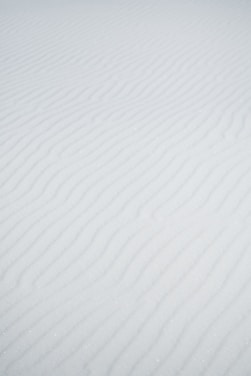 a person riding skis down a snow covered slope