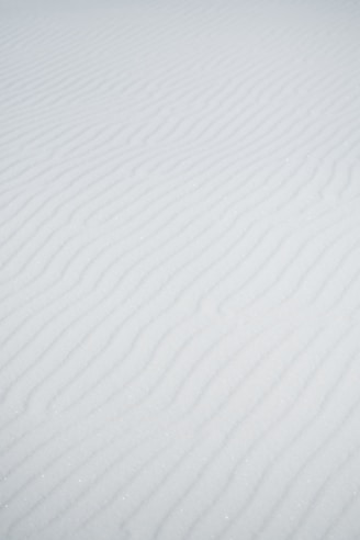 a person riding skis down a snow covered slope