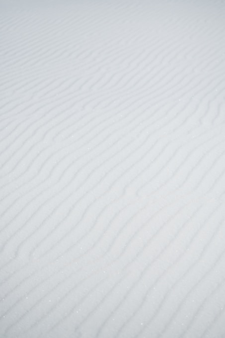 a person riding skis down a snow covered slope