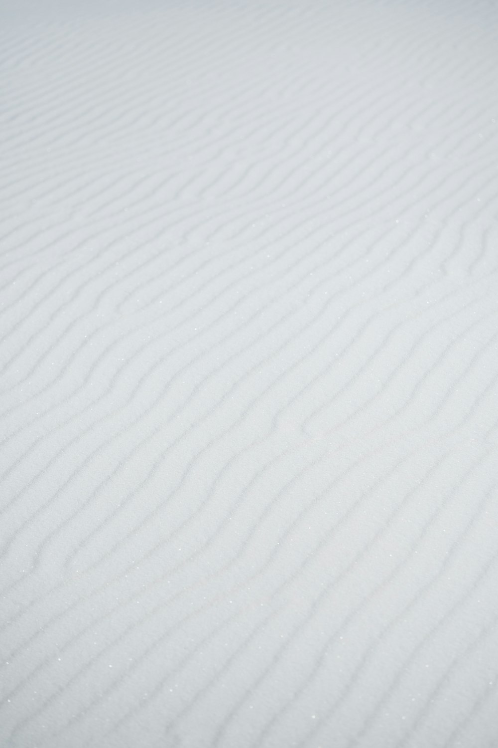 a person riding skis down a snow covered slope