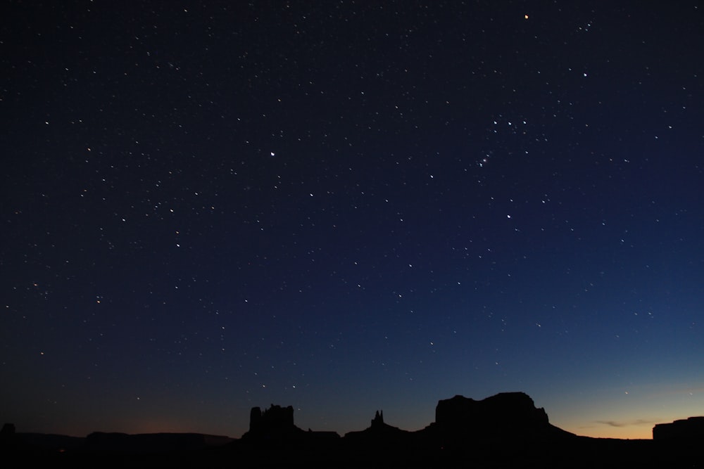 silhouette photo of mountain during nighttime