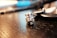 Close-up of a handmade space-themed figurine on a wooden table.