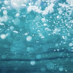 underwater photography of water bubbles