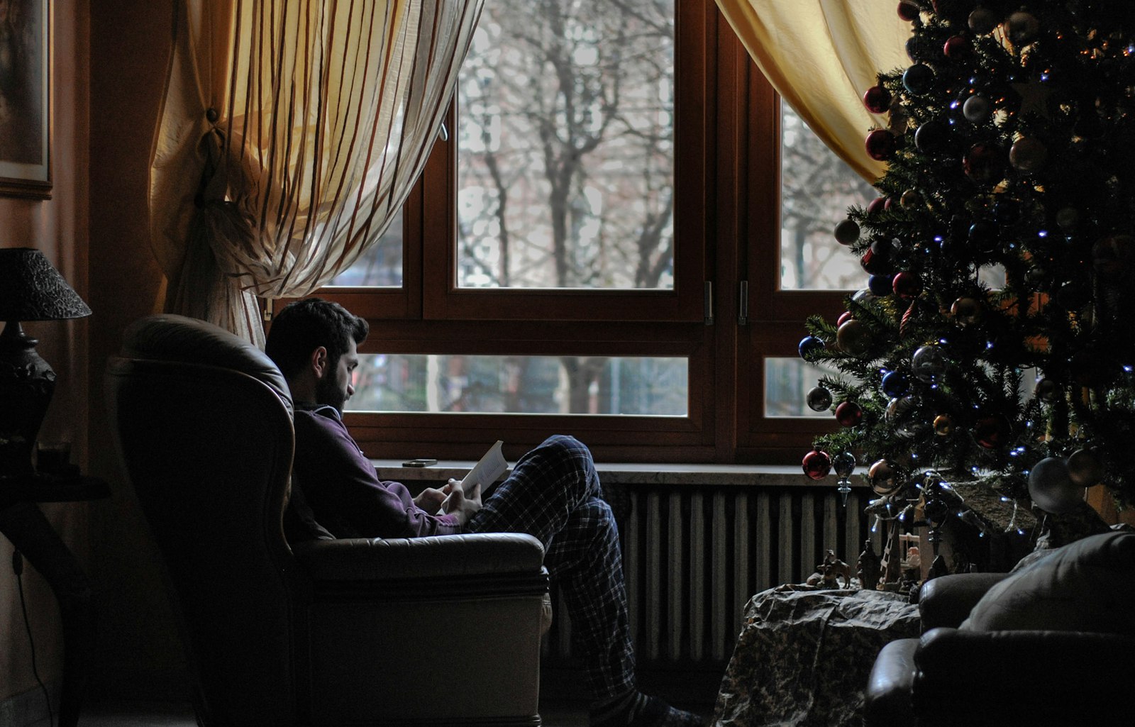 Nikon D3000 + Nikon AF Nikkor 50mm F1.8D sample photo. Man sitting on sofa photography