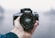 person holding Nikon DSLR camera