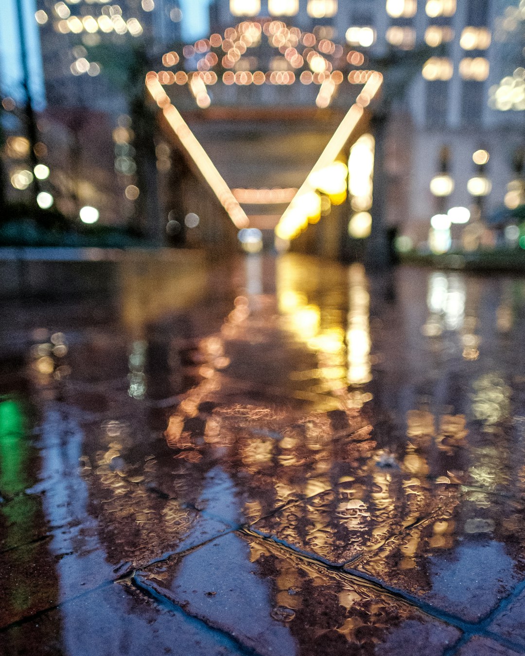 A blurred shot of a very wet city area.