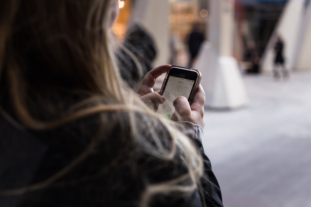 person unlocking smartphone