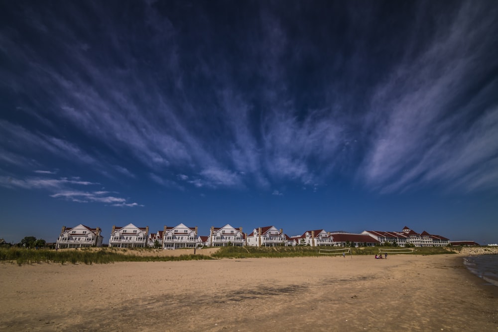 landscape photography of house under white clouds