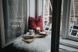 photo of gel candle on board beside pillow