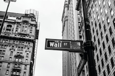 grayscale photo of 1-21 Wall street signage