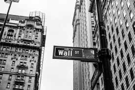 grayscale photo of 1-21 Wall street signage