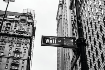 grayscale photo of 1-21 Wall street signage