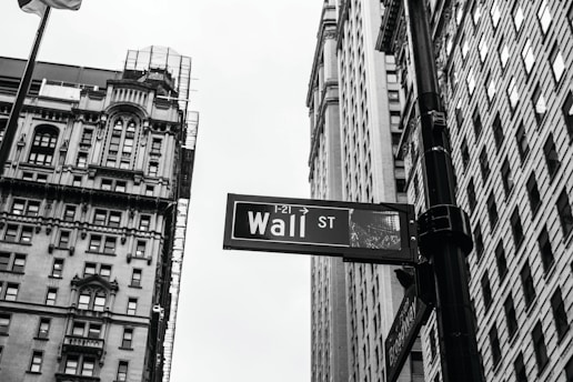 grayscale photo of 1-21 Wall street signage