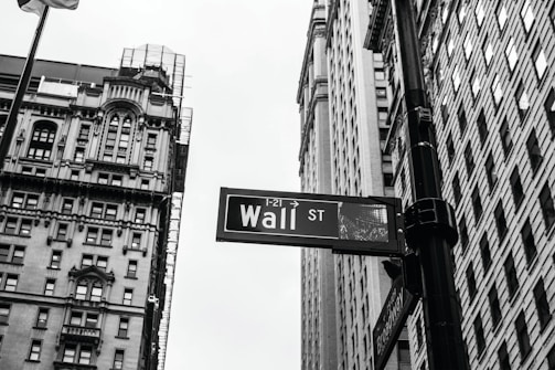 grayscale photo of 1-21 Wall street signage
