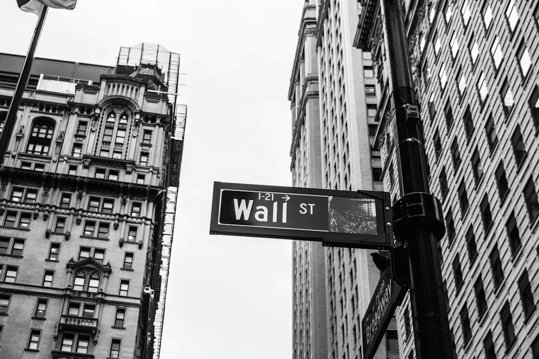 A Wall Street street sign in black and white