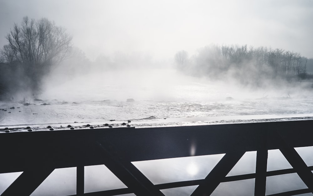 body of water near hand rail