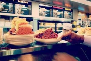 two hearty sandwiches on plate at the counter