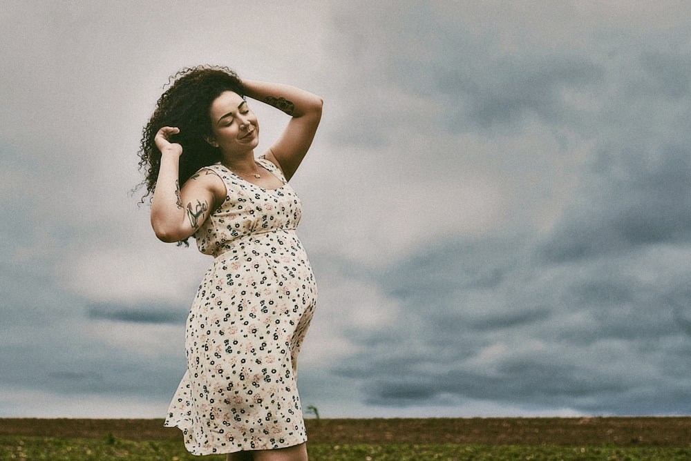 woman in black and white sleeveless dress